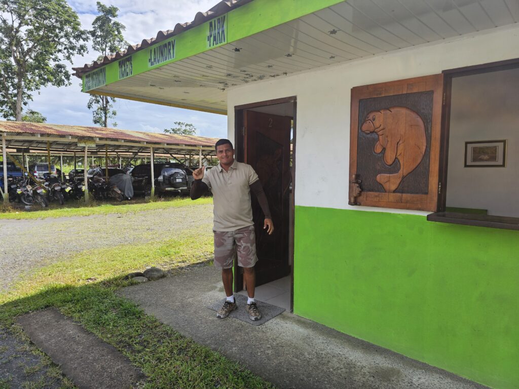 Contact Tortuguero Boat Captain Hosni waving at the camera